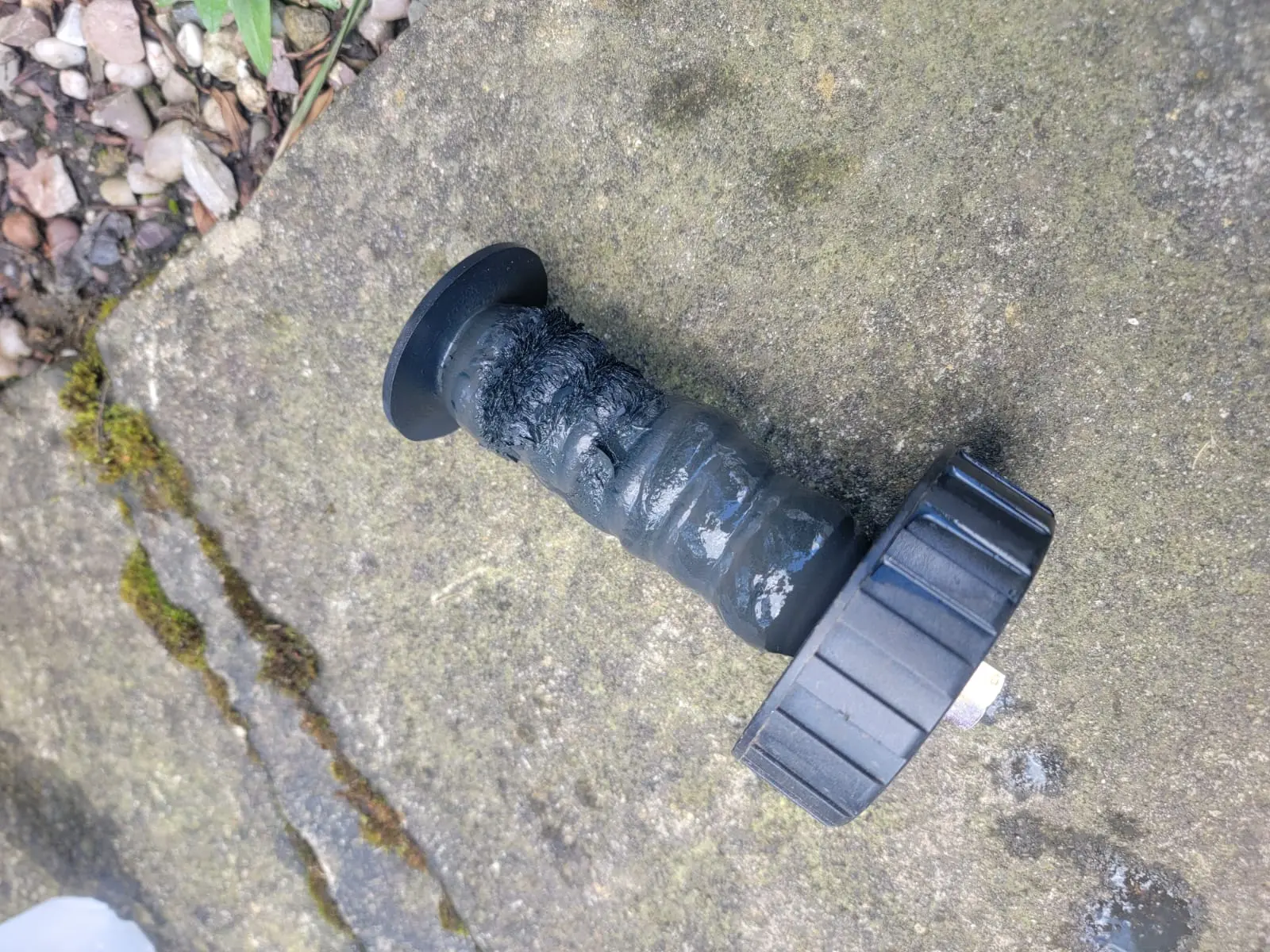 ATAG iGuard magnetic filter element coated in magnetite sludge after annual service by Kamdem HomeTech