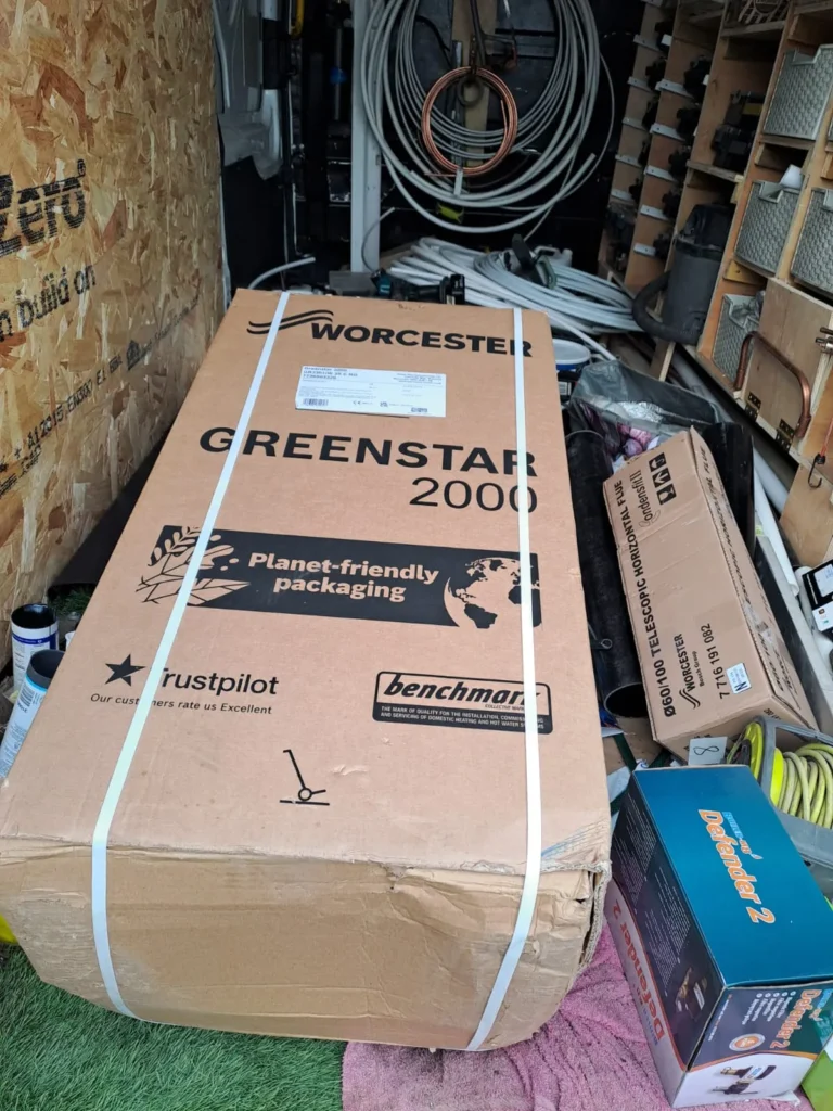 Worcester Bosch Greenstar 2000 28kW combi boiler with Worcester telescopic flue and Adey Defender 2 magnetic filter, ready for installation by Kamdem HomeTech in Greater Manchester
