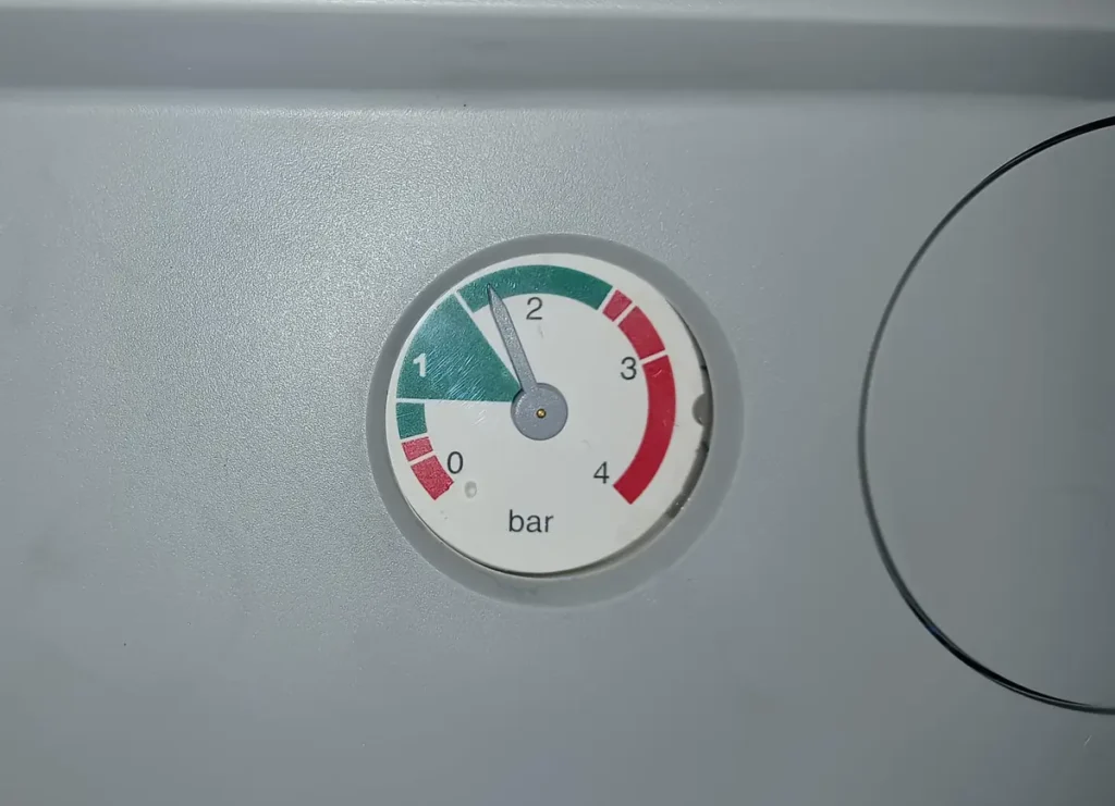 Potterton combi boiler pressure gauge reading about 1.5 bar, inside the green zone